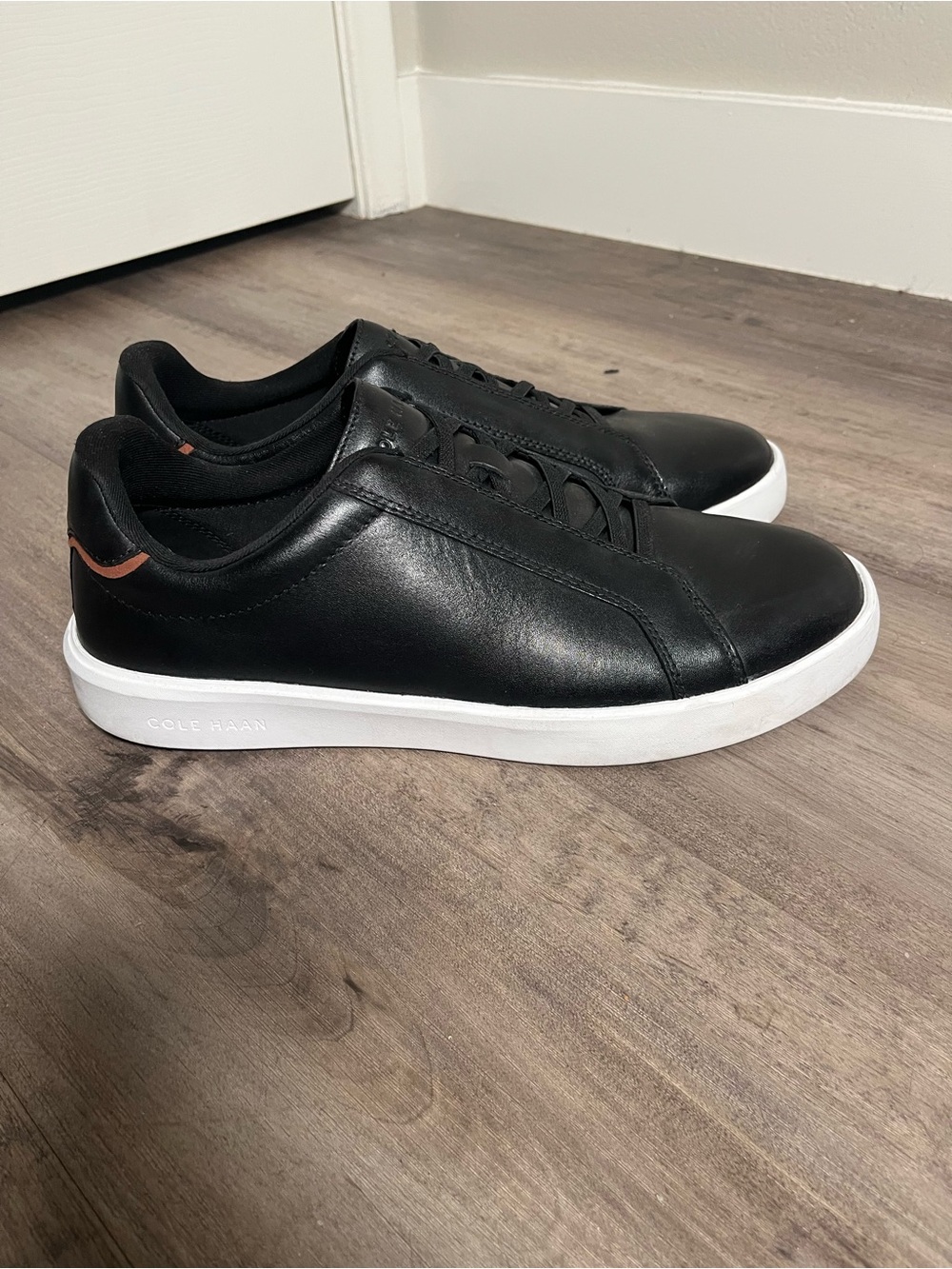 Cole Haan Black Leather Low-Top Sneakers with White Sole and Brown Heel Accent